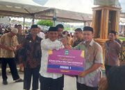 High Level Meeting, Bapenda Luwu Serahkan SPPT PBB-P2 2024 dan Reward Bagi Kades Berprestasi